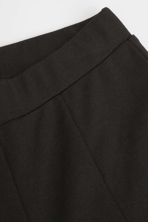 Spodnie dzianinowe czarne z rozszerzaną nogawką 2218495