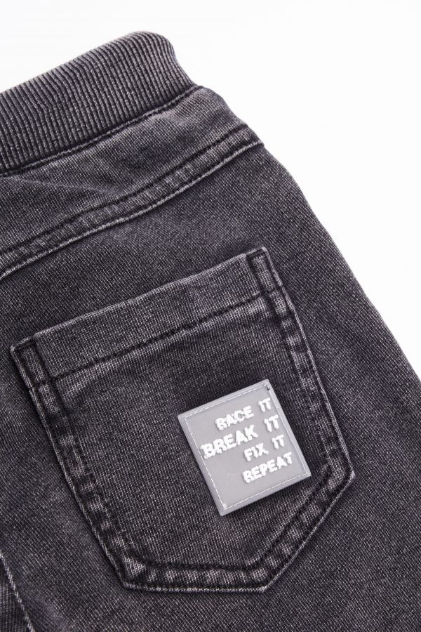 Spodnie jeansowe w kolorze szarym ze ściągaczami o fasonie SLIM 2156857