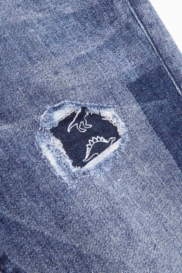 Spodnie jeansowe z efektem sprania i ozdobnymi przetarciami o fasonie SLIM 2194121