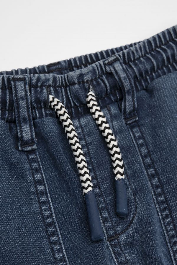 Spodnie jeansowe granatowe z wiązaniem w pasie o fasonie SLIM 2112681