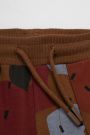 Spodnie dresowe brązowe z printem i napisami o fasonie SLIM 2225543