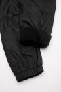 Spodnie tkaninowe czarne z odblaskowym nadrukiem i polarową podszewką 2200344